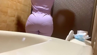 Amateur Captures A Hot Encounter With A Curvy Nurse In The Bathroom